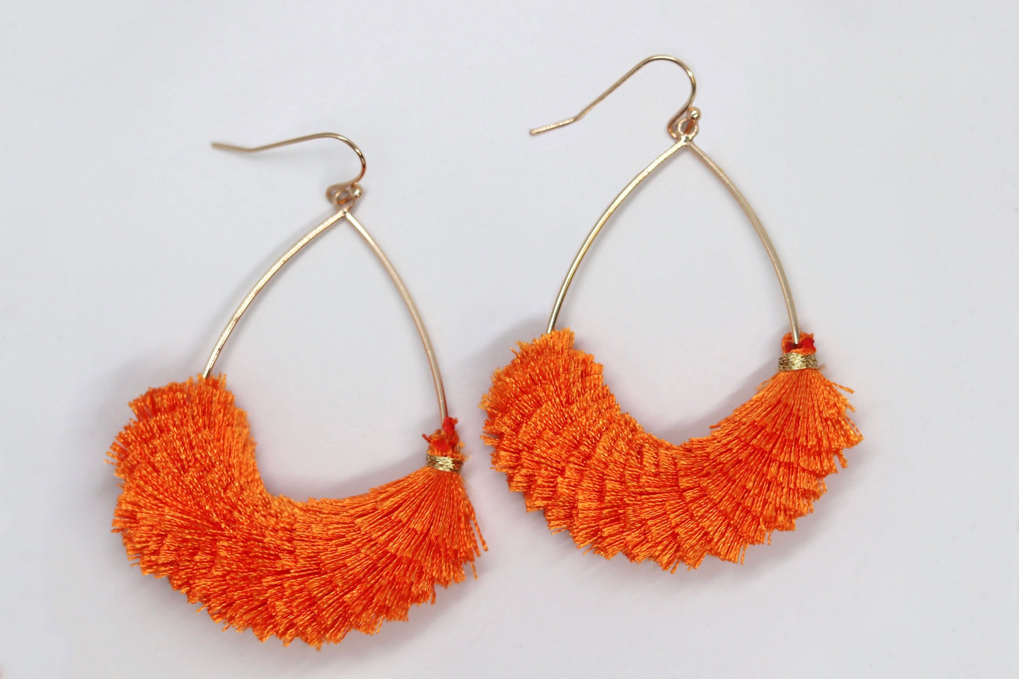 Orange tassel teardrop earrings